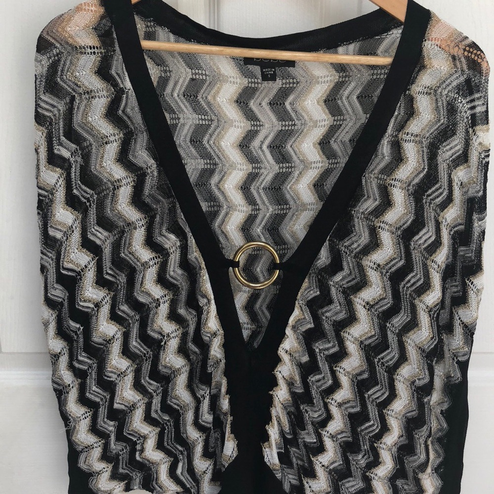 Knitted black Bebe top with round gold buckle